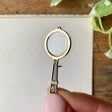 Georgiou Draws Magnifying Glass Enamel Pin