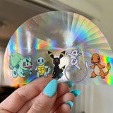 Pokemon Inspired (featuring Umbreon, Mew, Charmander, Squirrel, & Bulbasaur) rainbow prismatic window decal.