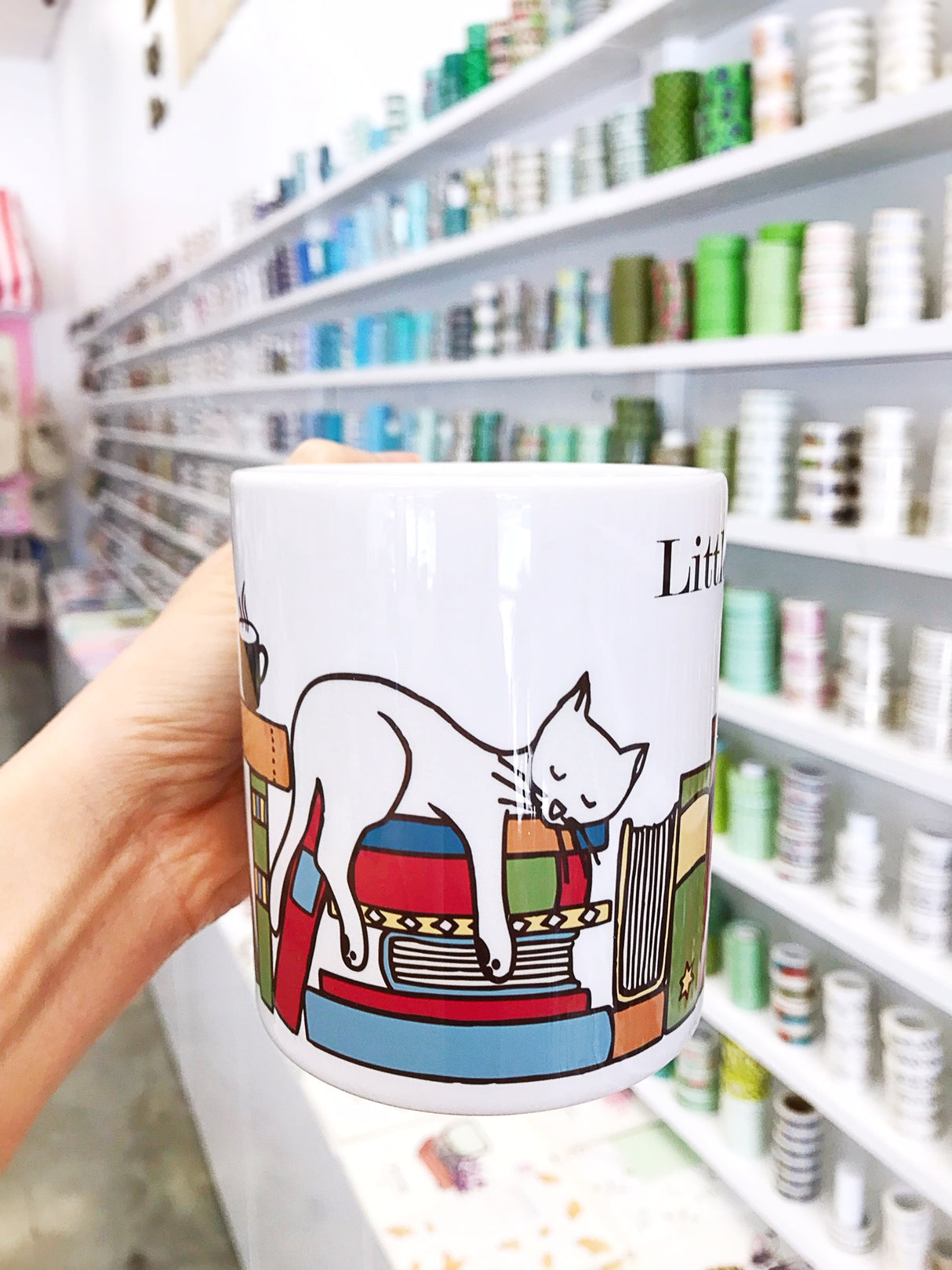 Our very own coffee mug!! If you love us and love books (and cat!) this mug is for ya!!